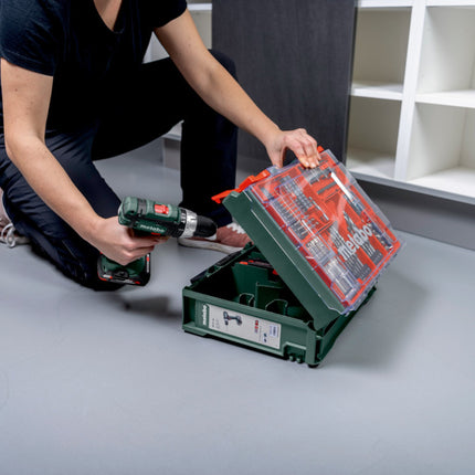 Metabo SB 18 L Set Perceuse-visseuse à percussion sans fil 18 V 50 Nm ( 602317710 ) + 2x batterie 2,0 Ah + chargeur + 78 pièces d'atelier mobile + coffret
